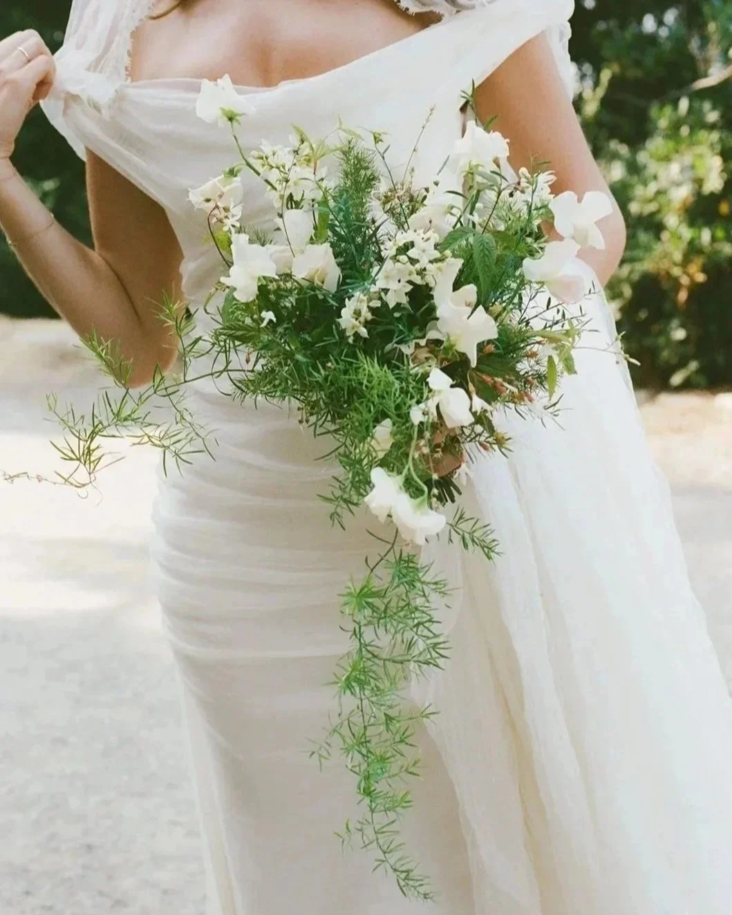 Cascading green and white floral bouquet