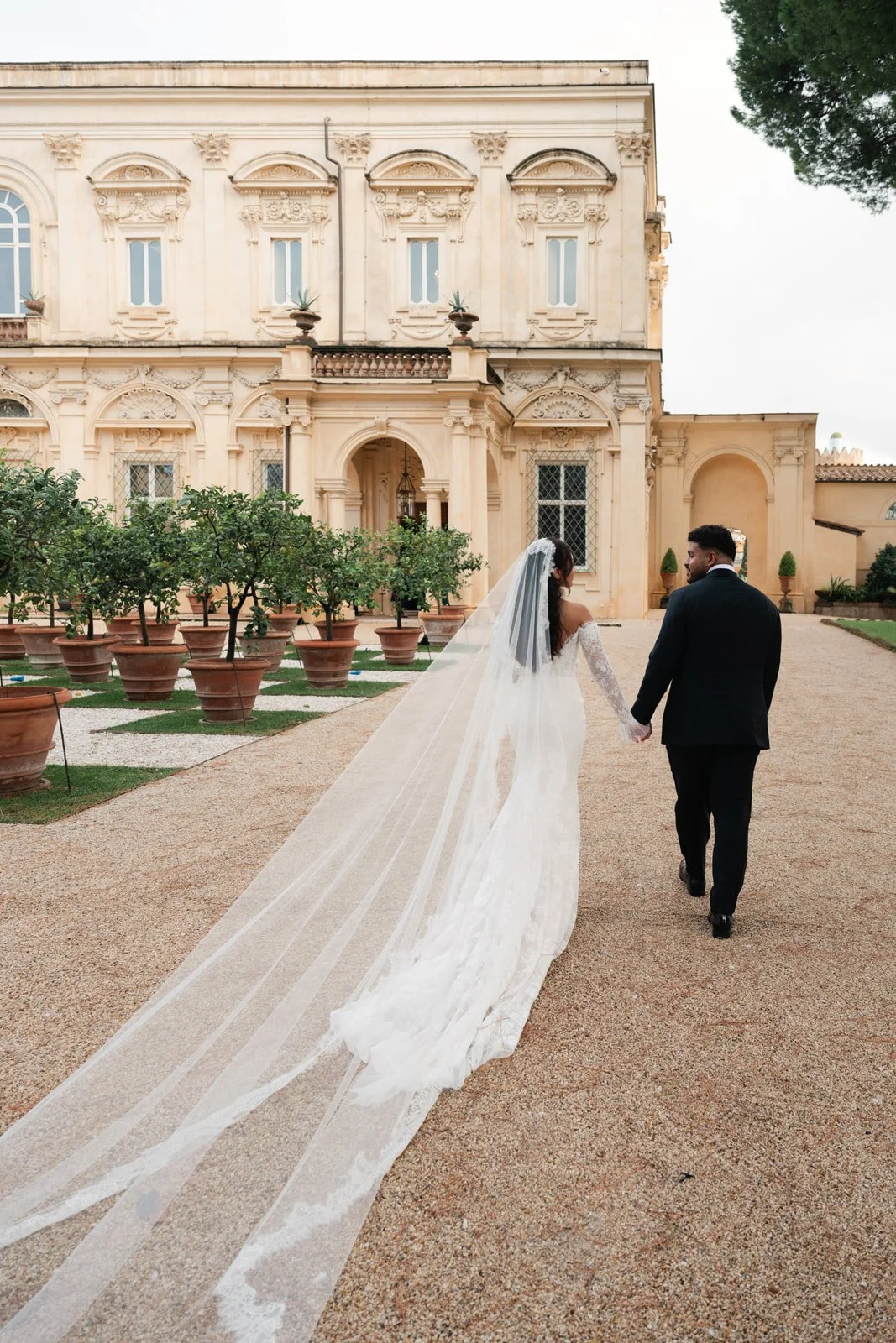 Couple outside Villa Aurelia, a historic wedding venue in Rome, Italy.