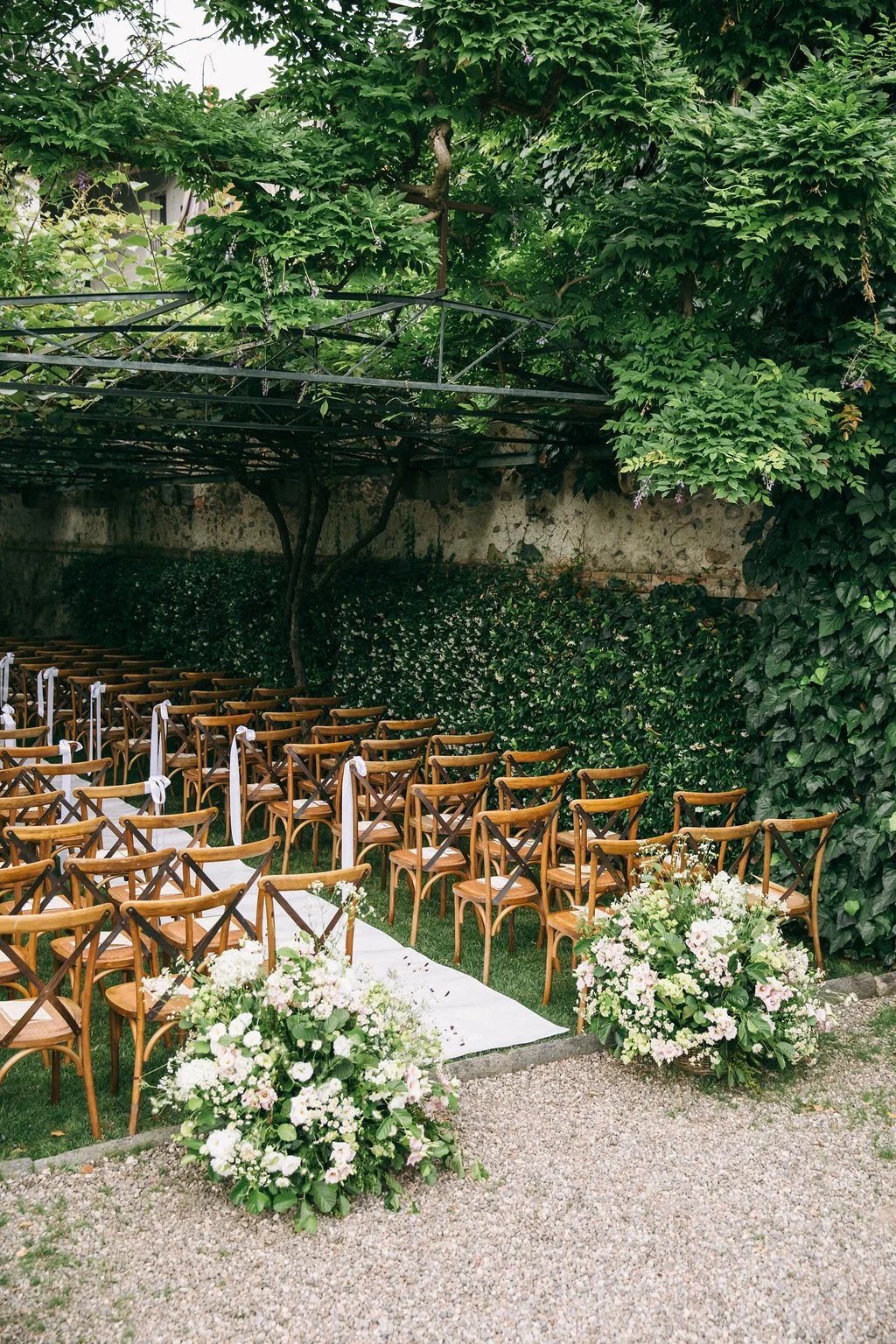 Green and white seasonal florals for wedding ceremony at Villa Bossi in northern Italy