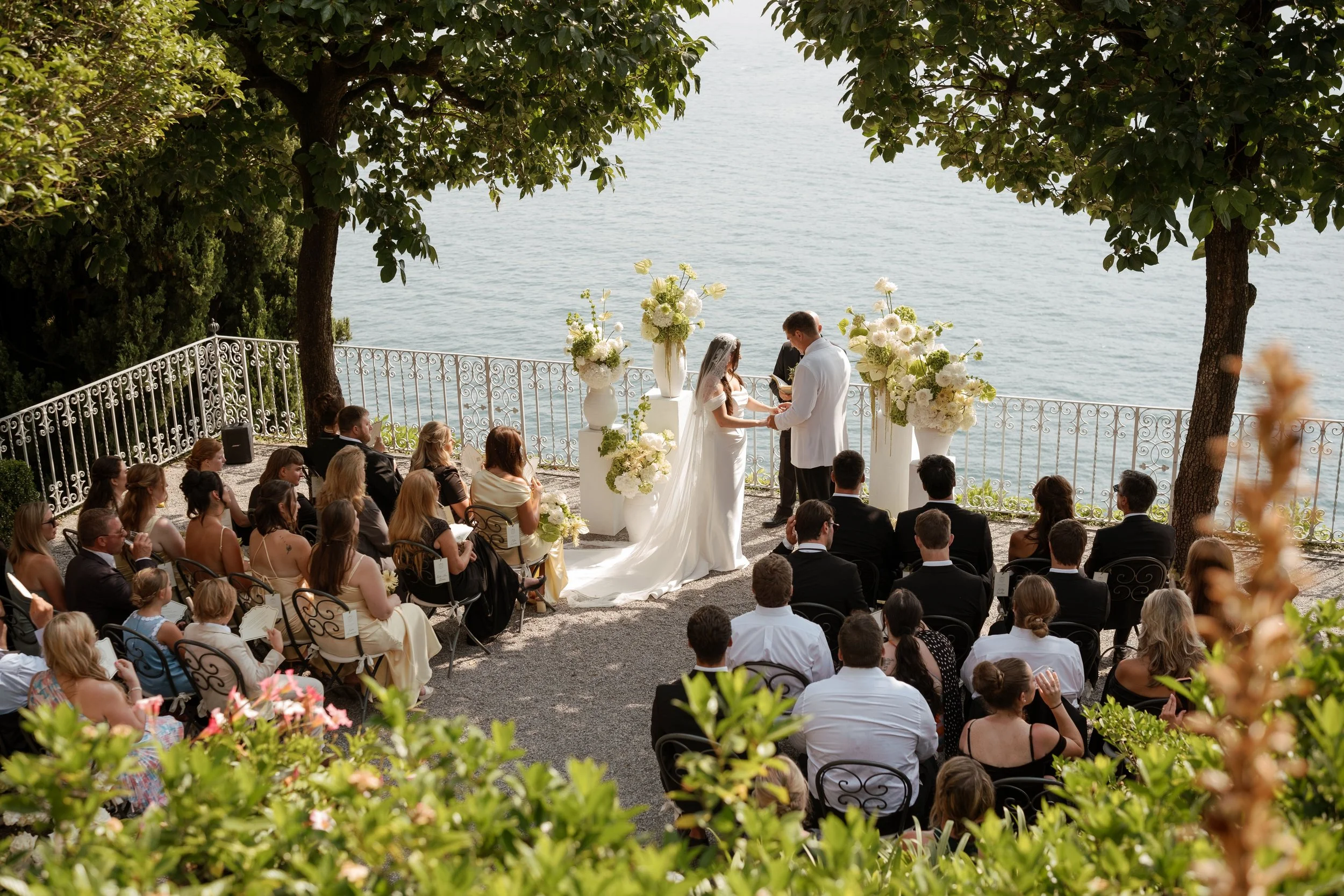 Italian wedding planner directing outdoor ceremony in Italy