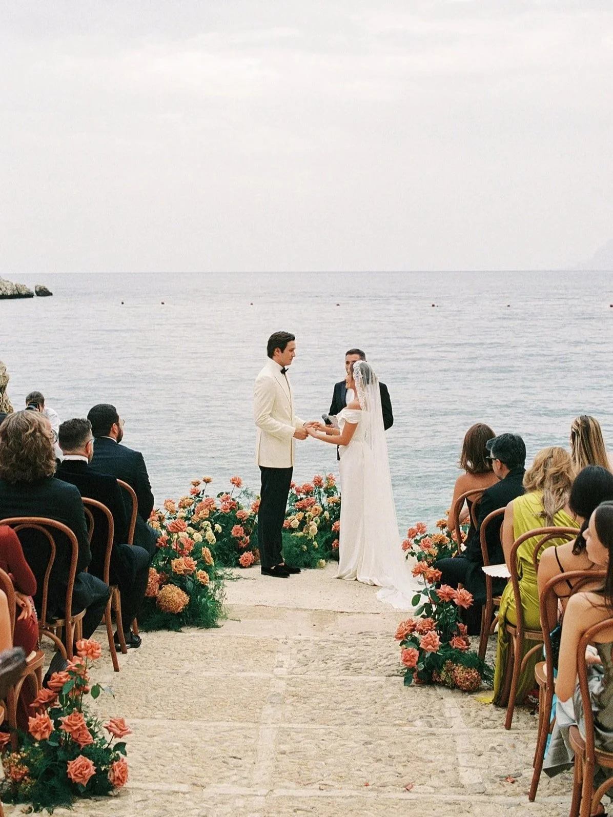 Pink florals and sea view ceremony at Tonnara di Scopello