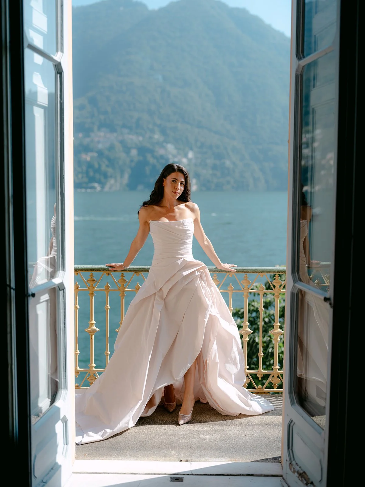 Lake Como Italian wedding rose wedding dress on balcony