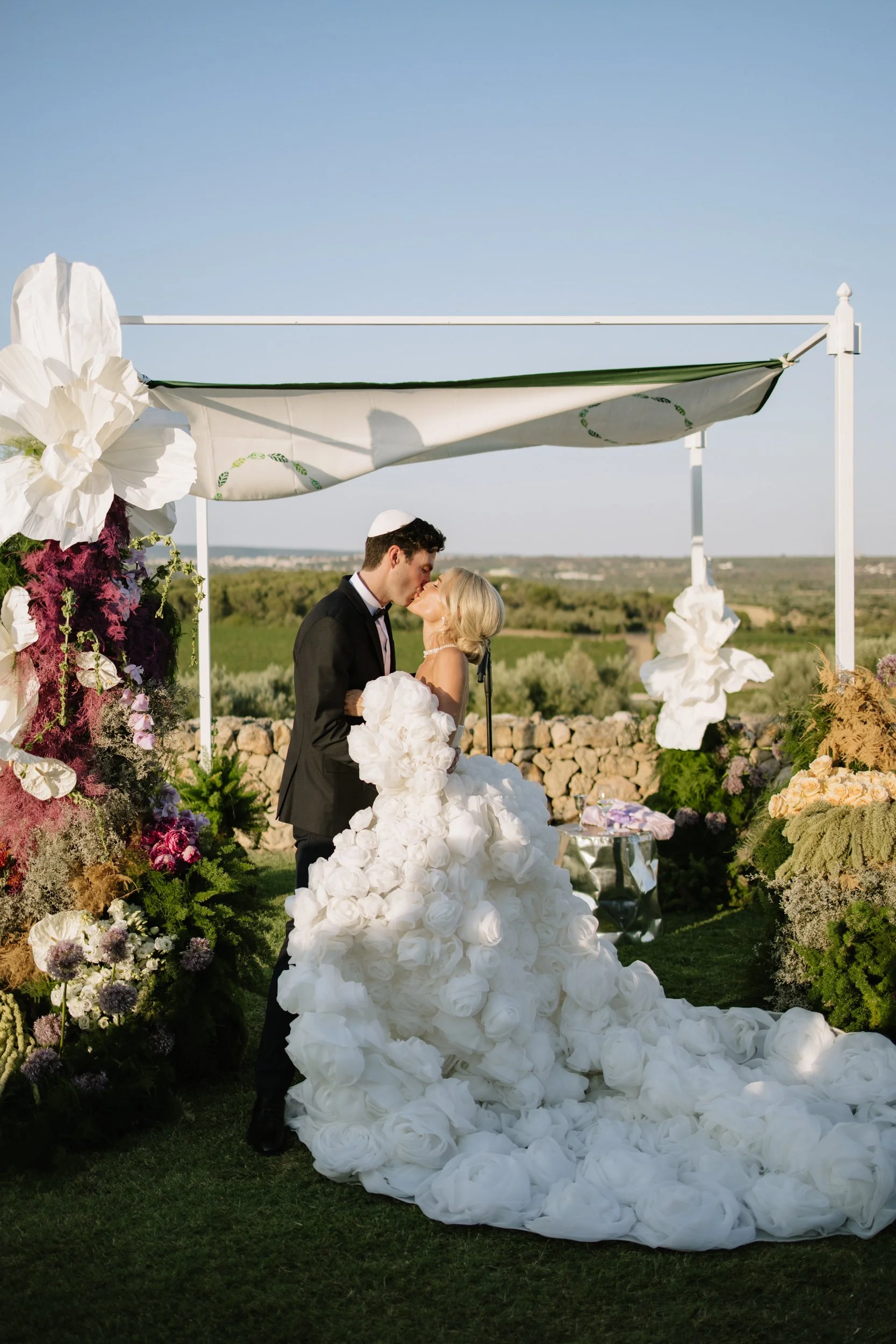Vibrant and colourful wedding ceremony florals in Puglia, Italy.