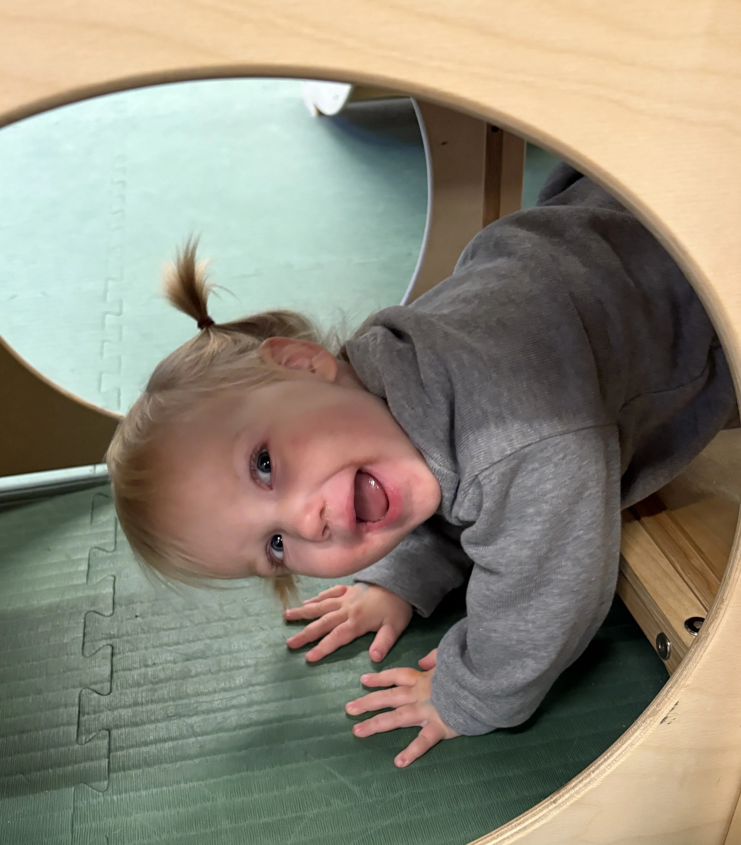 ECC toddler playing on recess toy