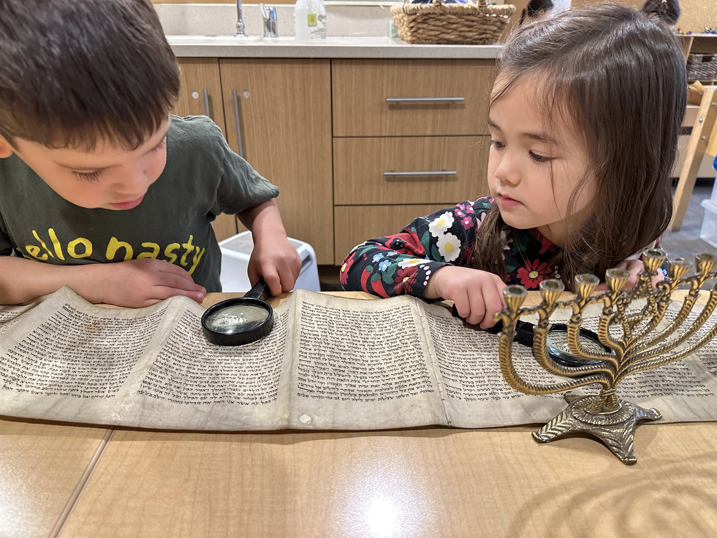 ECC toddlers examine torah scroll