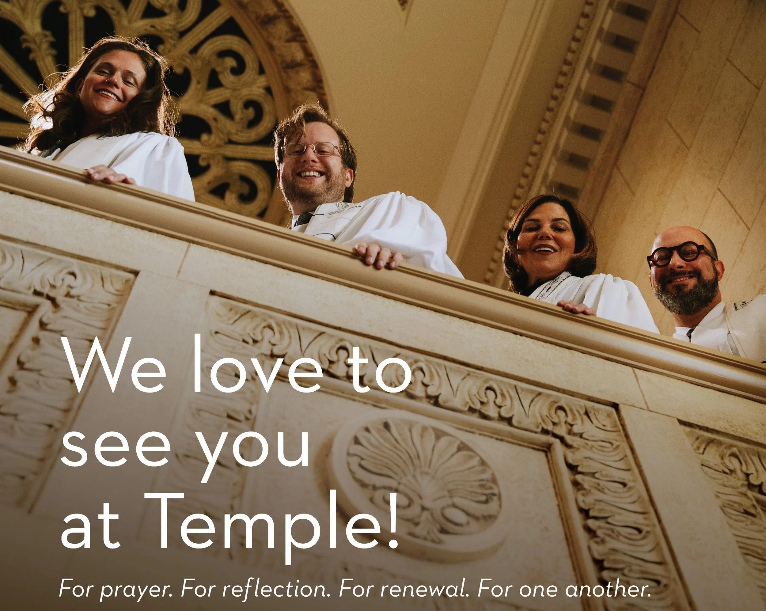 Temple clergy smile and  look over sanctuary balcony