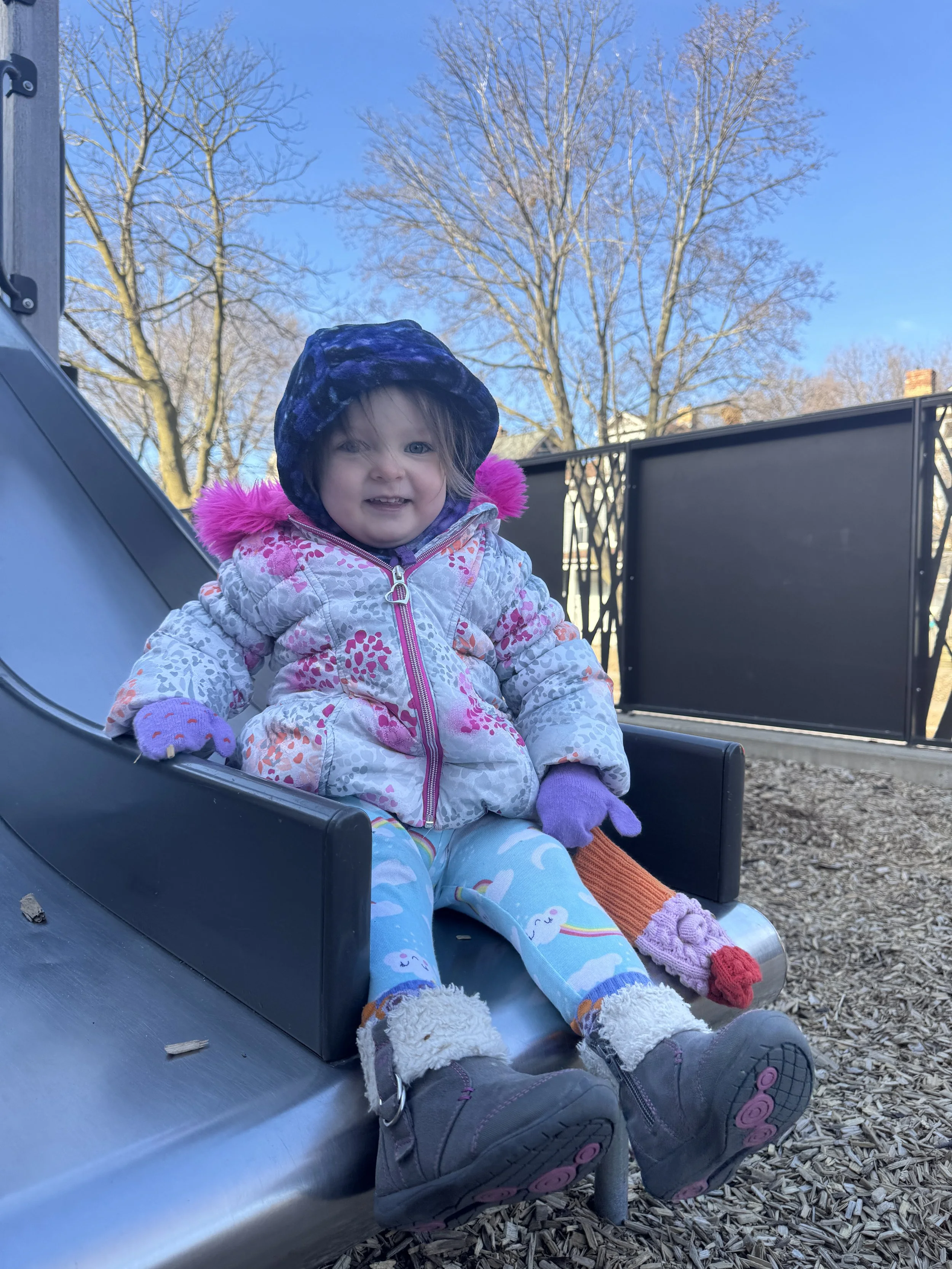 ECC toddler playing on recess toy