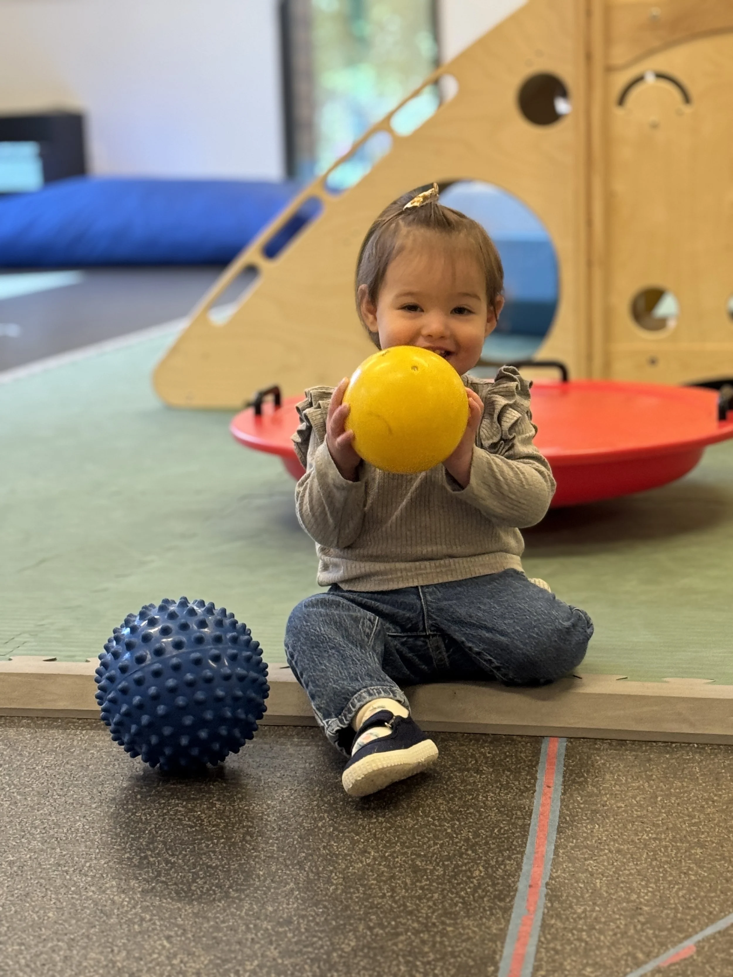 ECC toddler plays with ball