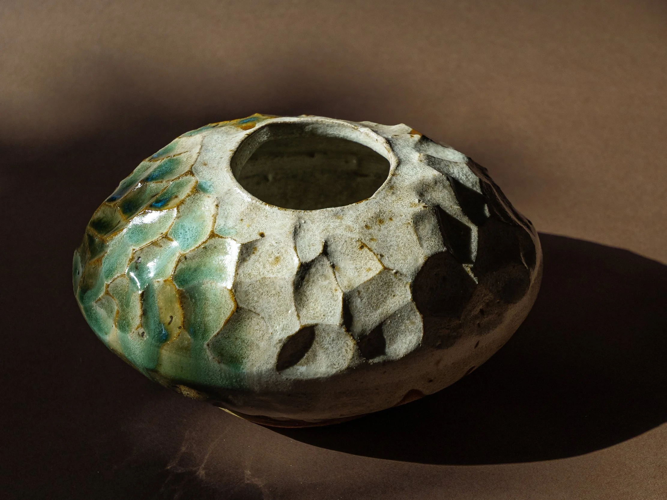 Textured Vessel/ Vintage oblong-shaped glazed vessel/ Features: Prominent carved texture & drip glaze detail/ Color: Turquoise & Khaki/ Dims: 6.6” L × 3.5 H x 5 W