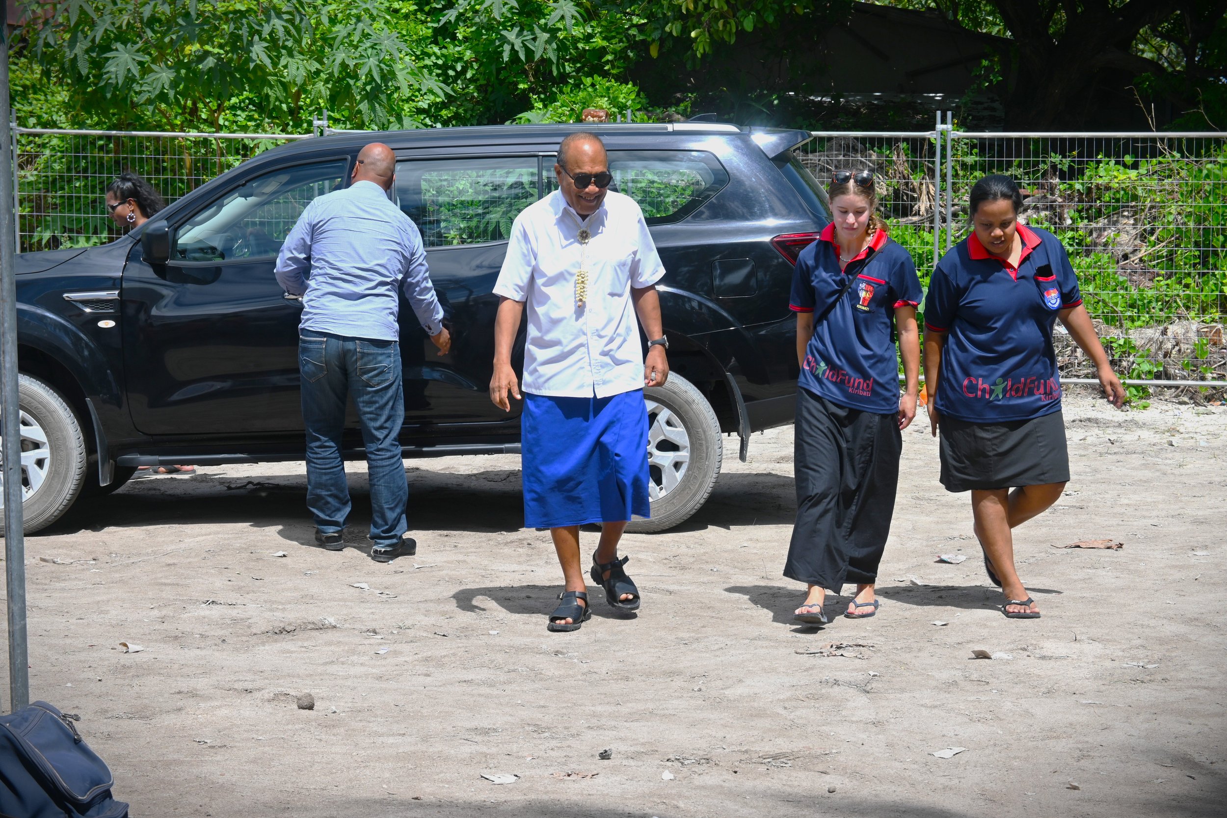 ChildFund staff Teborataake and Crissy escorting His Excellency.JPG