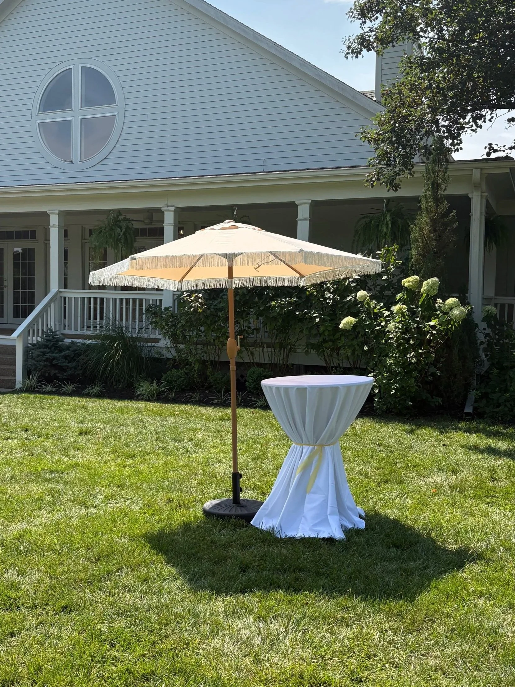 Beige + White Fringe Outdoor Umbrella and Base: $30/umbrella (up to 5)