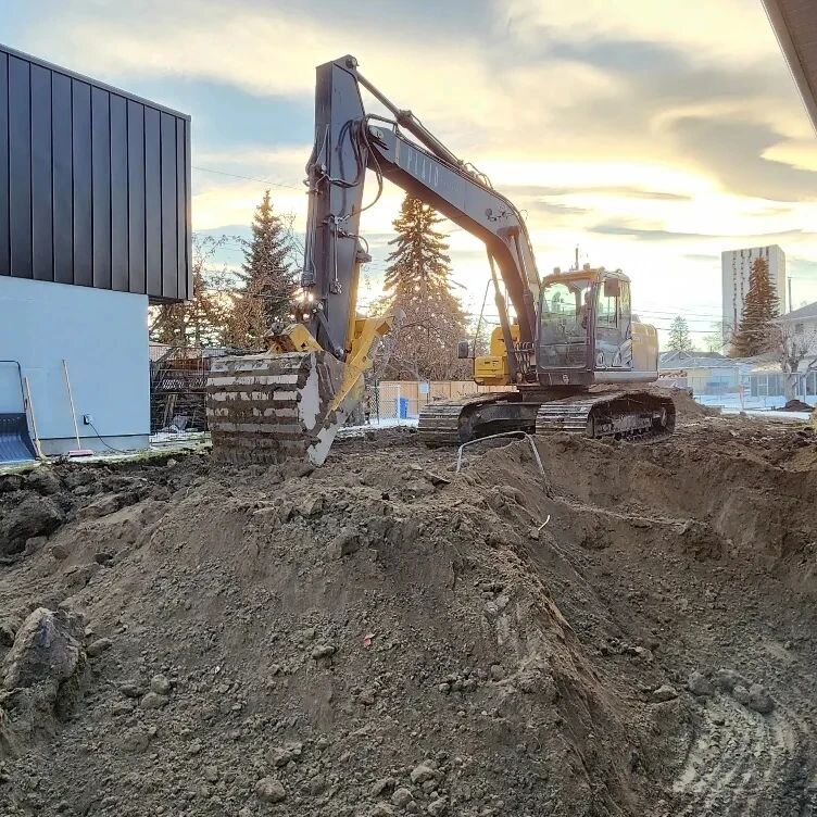 Just plugging away digging holes and filling them back in again!

Excavation of the front and rear addition sites, footings and foundation walls cribbed and poured, and a little insulated tarp action to keep the frost at bay.

Prior to any cribbing o