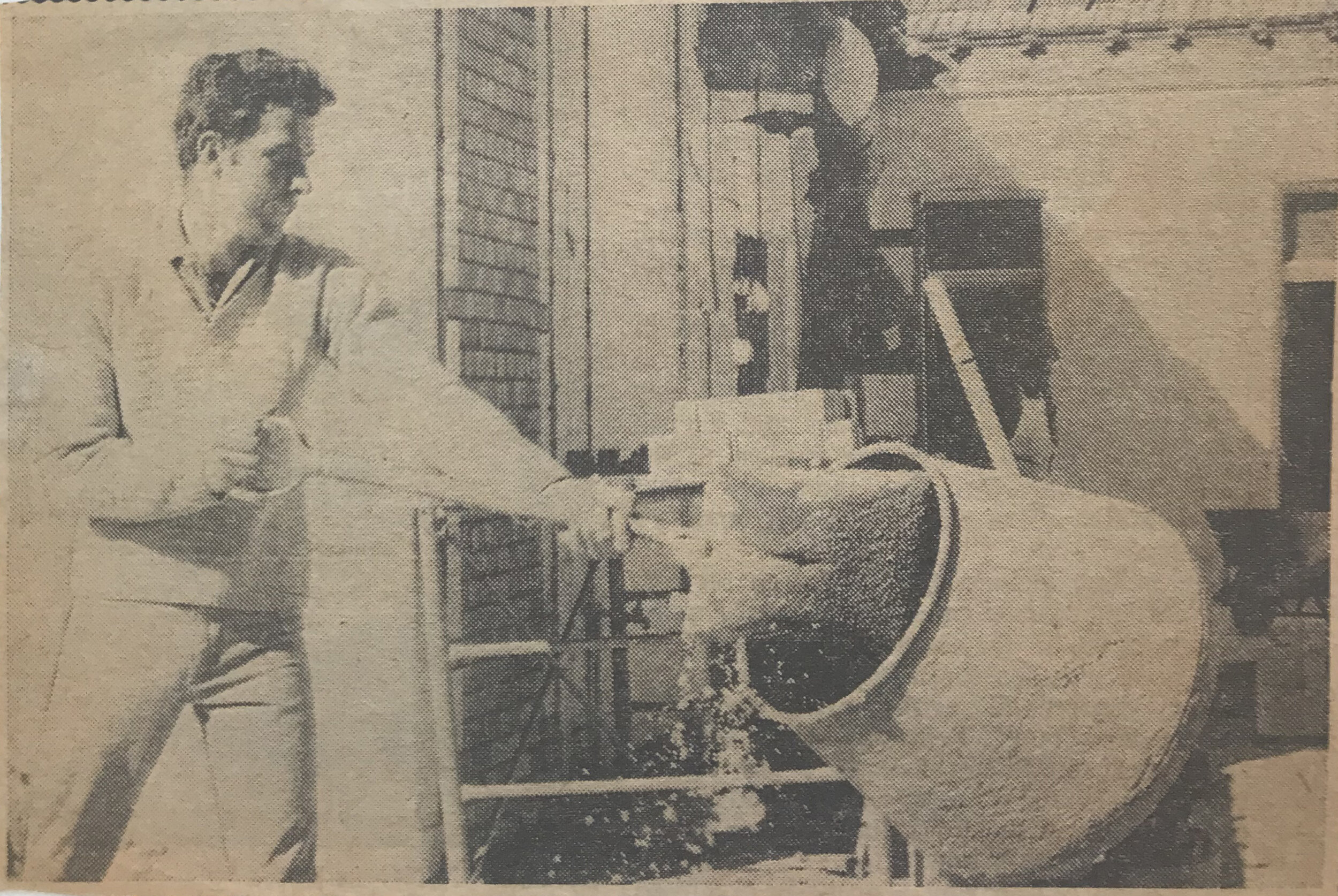 Arnold Roberts of Lorn mixing material for internal brickwork.