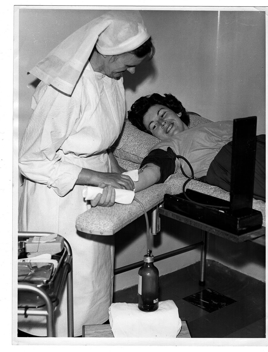 Maitland Mercury photo of a nurse taking a patient's blood pressure, undated.