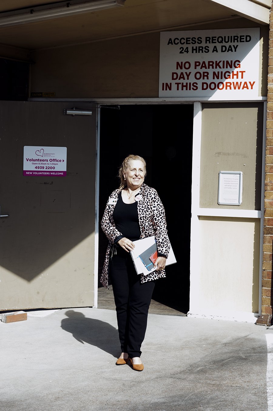 Kim Simpson at the entrance to the Volunteers' Building.