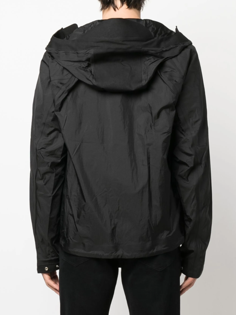 Ten C Wind Combo Bonded Jacket in black with nylon ripstop, OJJ fabric, and lightweight design.