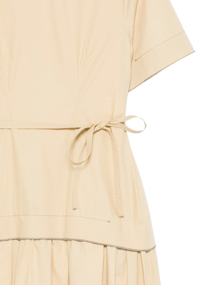 Tela D. Lost midi dress in beige with pleated skirt, belt, and short sleeves.