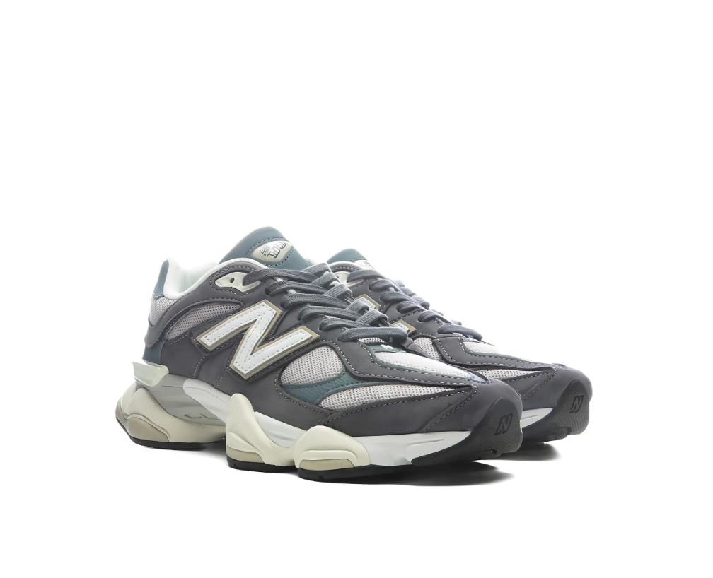 New Balance 9060 sneakers for women in grey with mesh and leather upper, chunky sole, and logo detail.