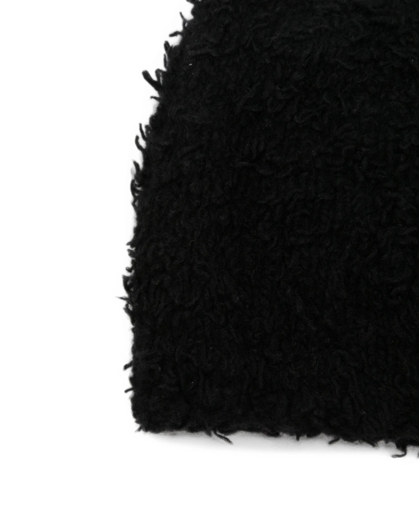 WARM-ME FRINGE Bouclé Beanie in Black, crafted from 100% pure cashmere with a textured bouclé knit and fringed detailing.