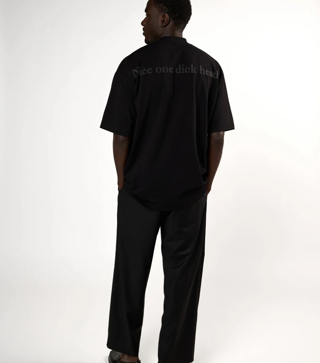 HOPEIUM men’s “NICE ONE DICKHEAD” T-shirt in black with oversized fit and bold 3D back print.