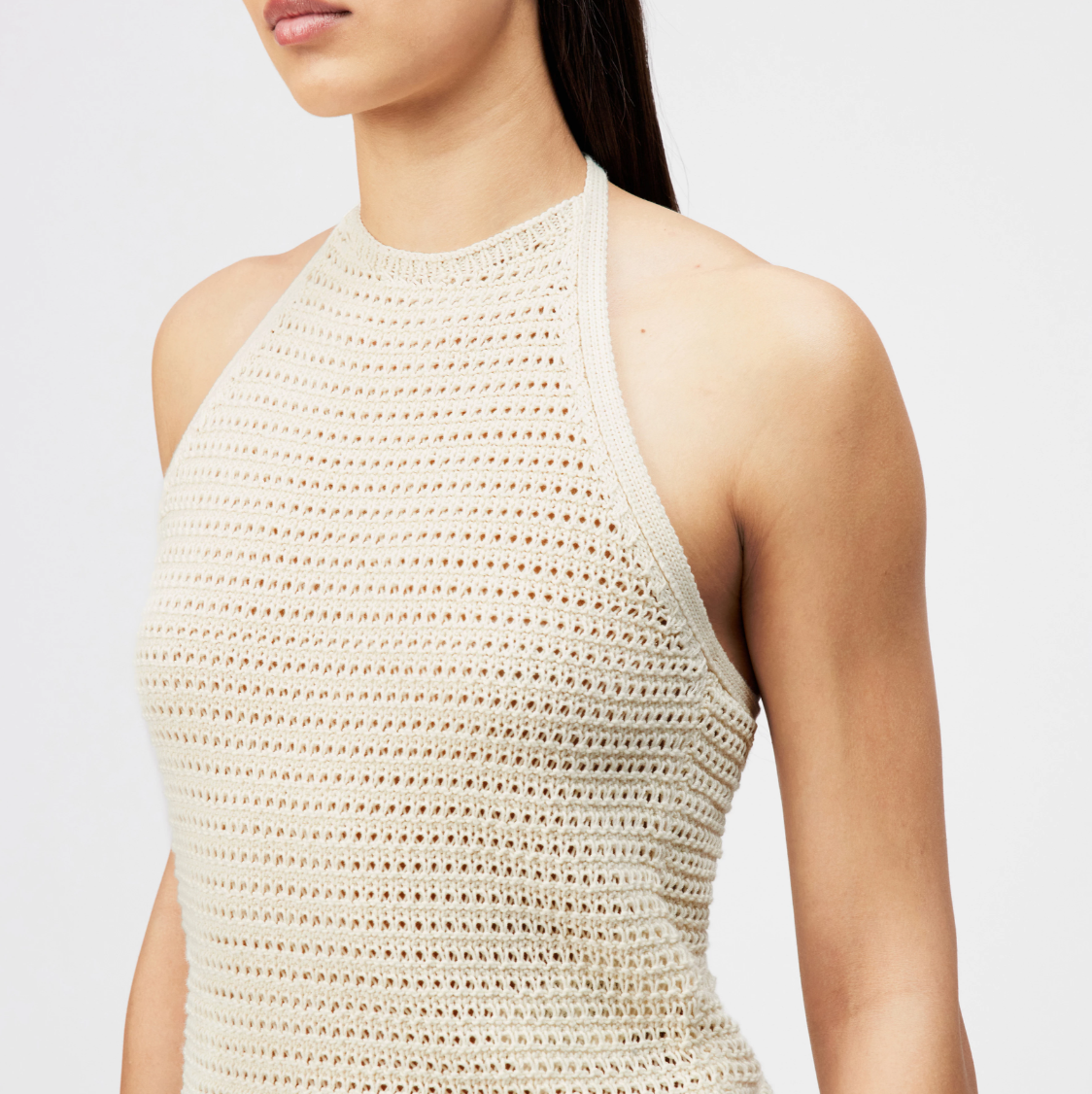 Drykorn AKWY knit top in natural white with halter neck, slim fit, and cropped length in 100% cotton.