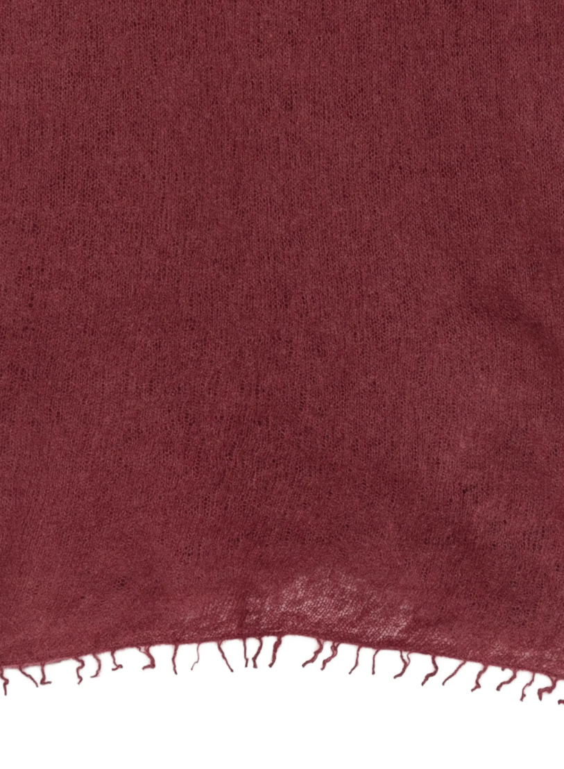 WARM-ME Small NOMAD Scarf in Maroon Banner, crafted from 100% pure cashmere with a lightweight, semi-sheer fine knit and fringed edges.