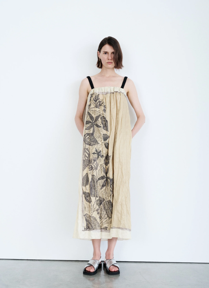 Tela D. Erin midi dress in beige with floral print, straps, and gathered details.