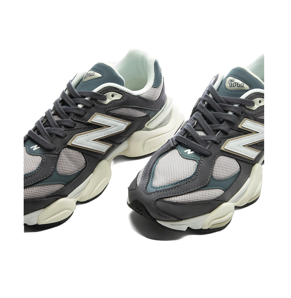 New Balance 9060 sneakers for women in grey with mesh and leather upper, chunky sole, and logo detail.