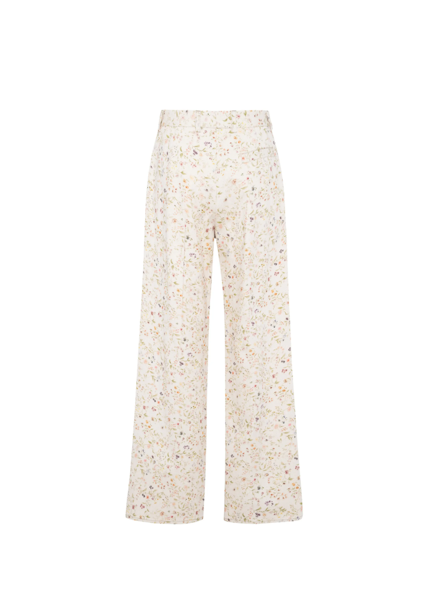 Tela floral print trousers in cream with wide leg, belt, and concealed closure.