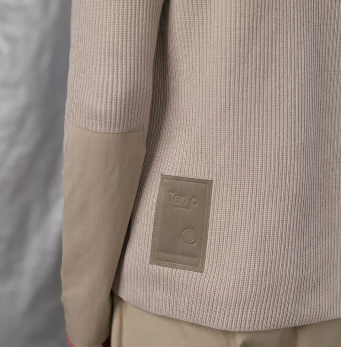 Ten C cotton knit sweater in pale taupe with ribbed texture and OJJ fabric sleeve details.