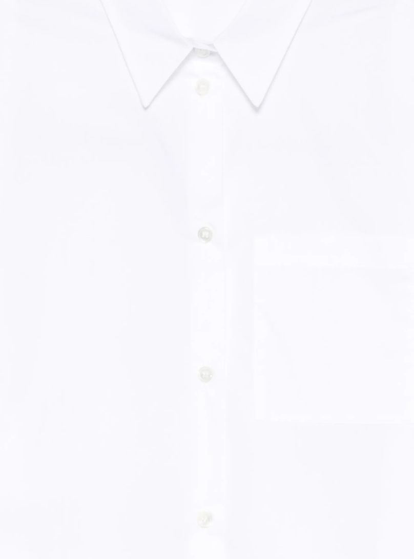 White sleeveless shirt by Tela, made in Italy with button closure and chest pocket for clean, modern styling.