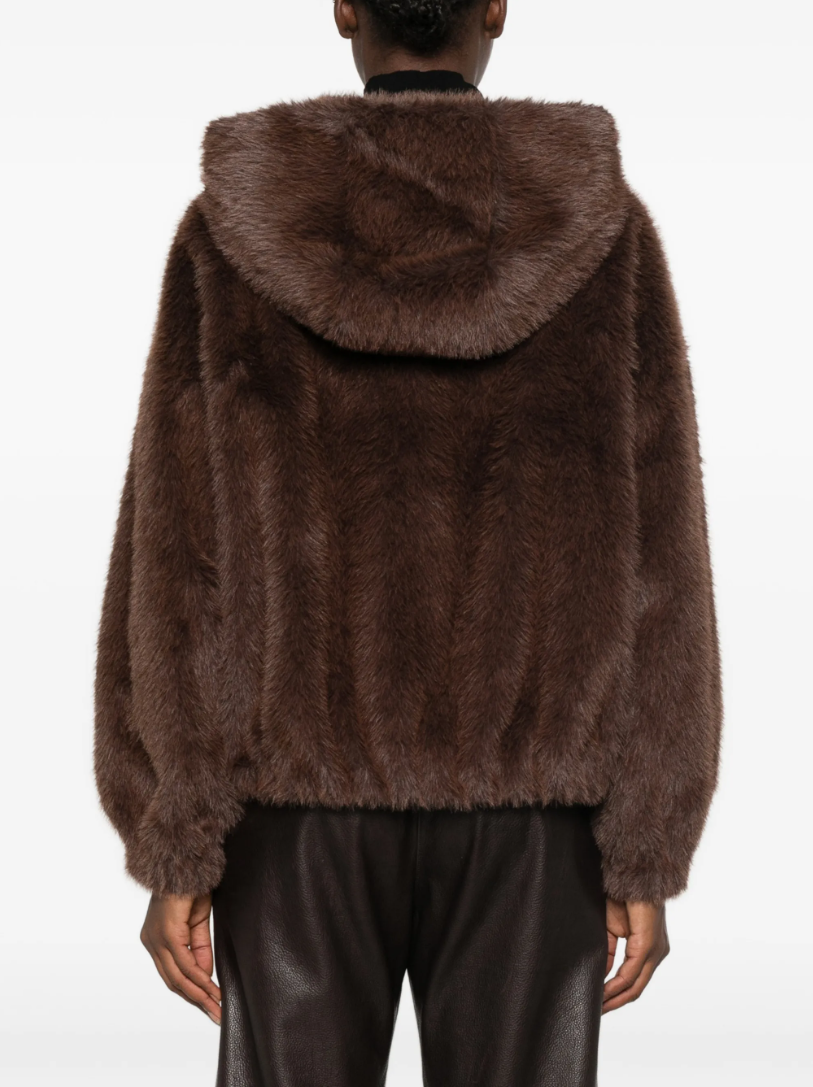 TELA Teddy Fur Jacket in Brown, featuring a plush teddy texture, hood, front zip closure, oversized side pockets and front patch pocket.