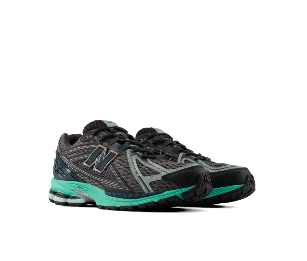 New Balance 1906R sneakers for men in black and teal with mesh upper and cushioned sole.