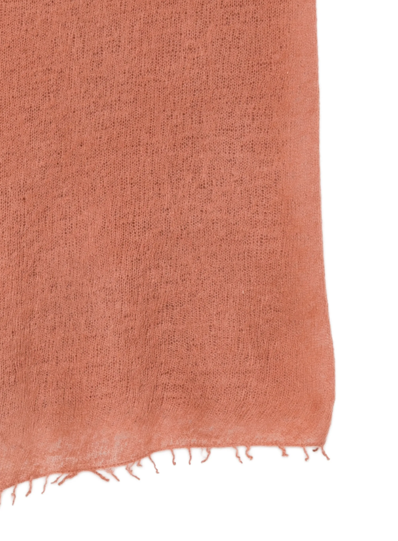 WARM-ME Small NOMAD Scarf in Terracotta, crafted from 100% cashmere with a lightweight fine-knit texture and fringed edges.