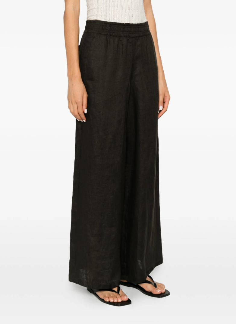 Drykorn CEILING linen trousers in brown with low waist, elastic waistband, and relaxed fit.