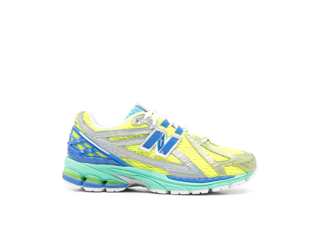 New Balance 1906R sneakers for women in yellow multicolour with mesh upper and metallic panels.
