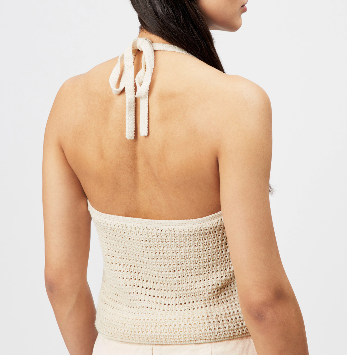 Drykorn AKWY knit top in natural white with halter neck, slim fit, and cropped length in 100% cotton.