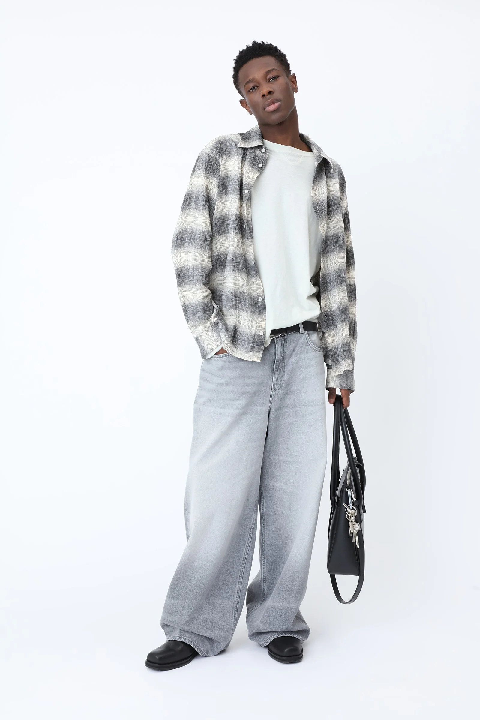 Won Hundred LYON Jeans for men in Bright Black, crafted from organic cotton denim with an oversized fit, wide straight legs and a washed finish.