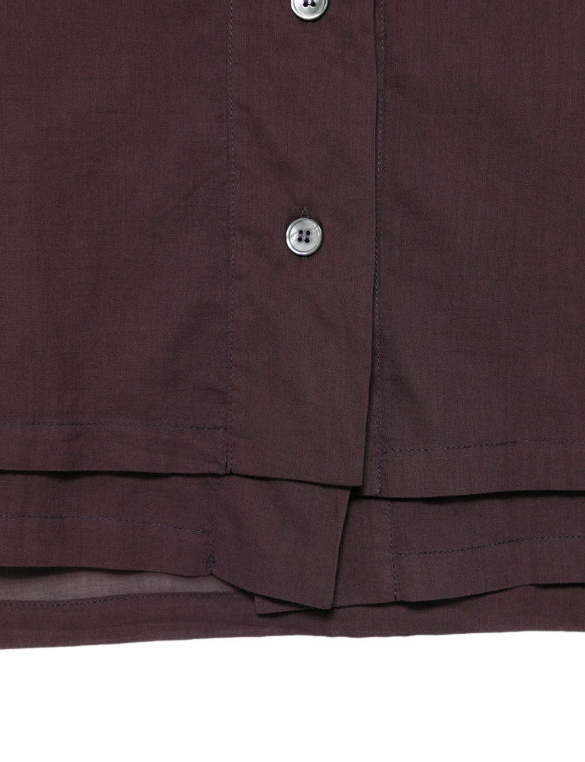 Tela dark purple shirt with button closure, long sleeves, and layered-look hem.