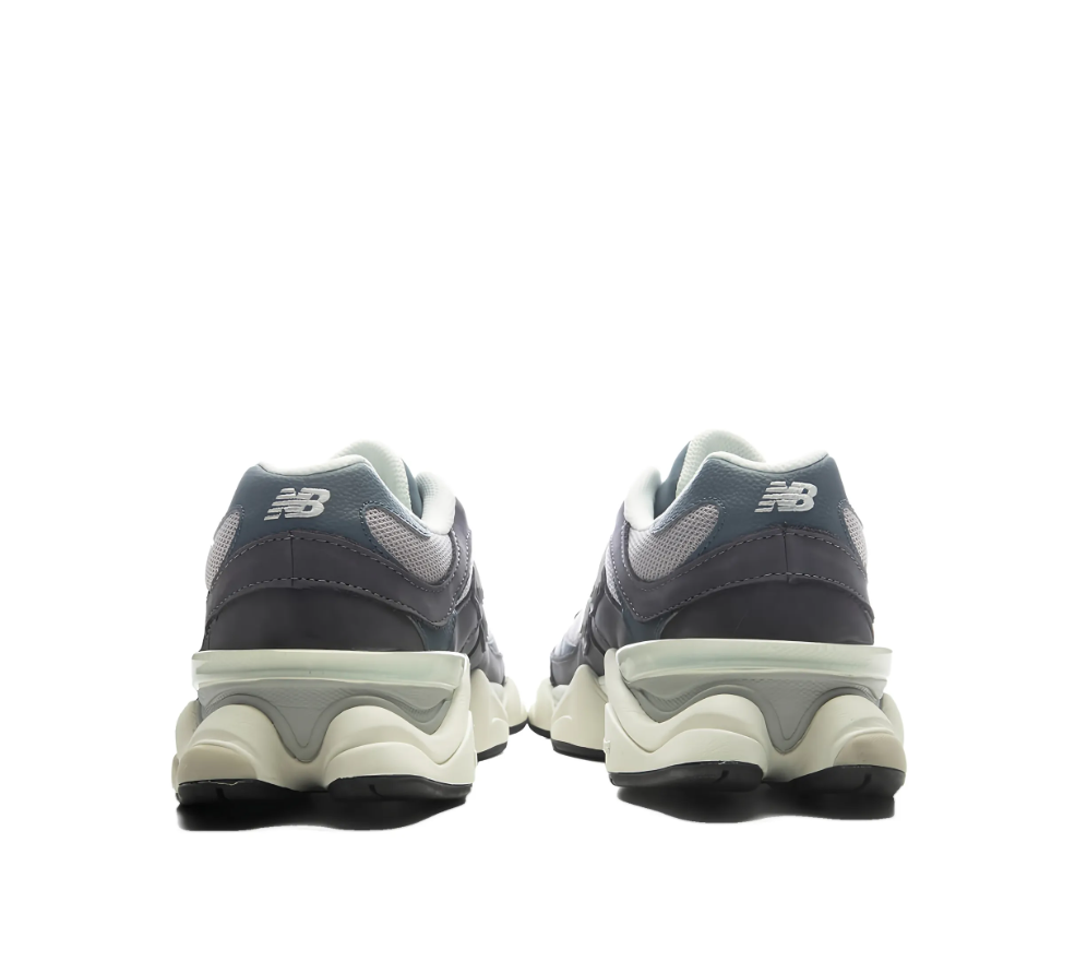 New Balance 9060 sneakers for women in grey with mesh and leather upper, chunky sole, and logo detail.