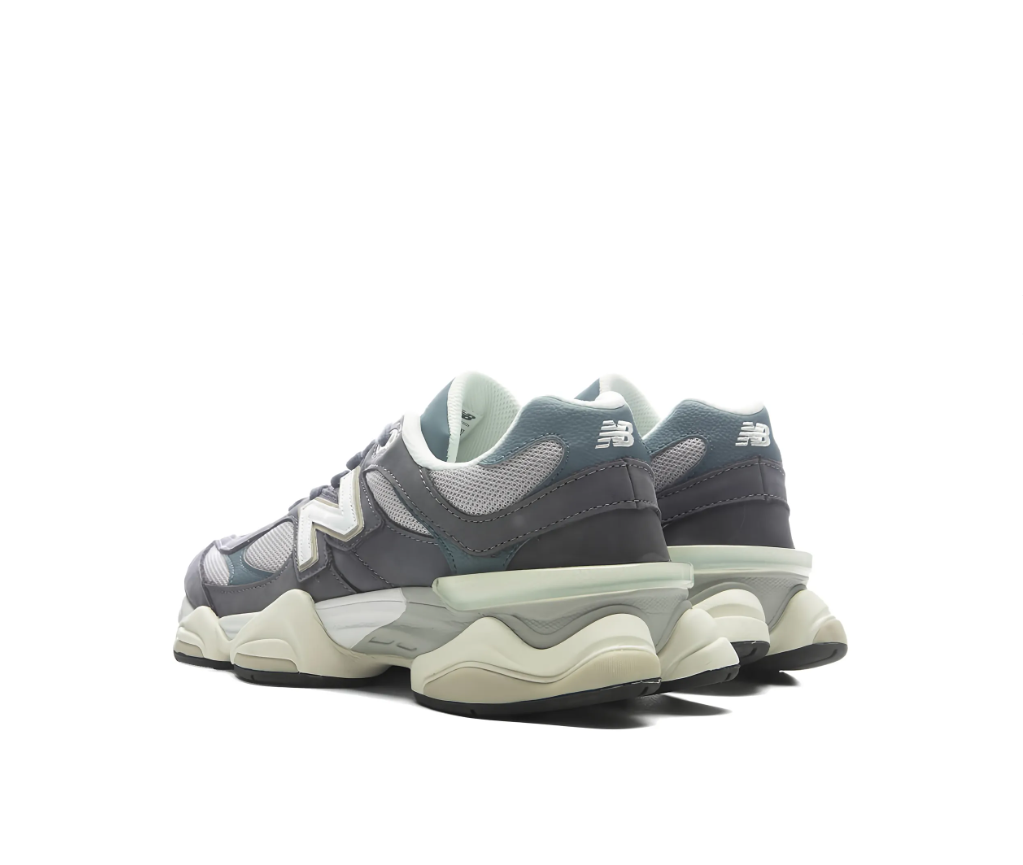 New Balance 9060 sneakers for women in grey with mesh and leather upper, chunky sole, and logo detail.