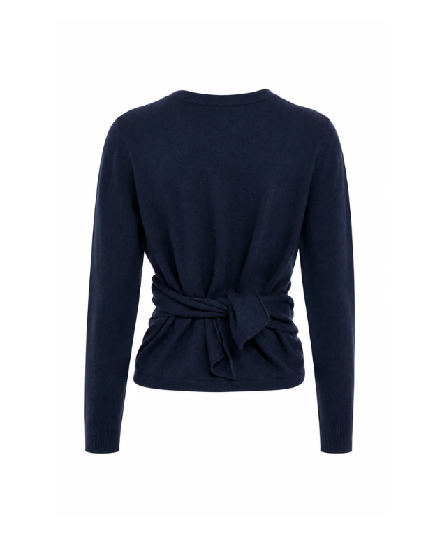 TELA Crossover Knit Top in Blue, crafted from soft carded wool with a wrap-effect front, draped waist and adjustable back tie.