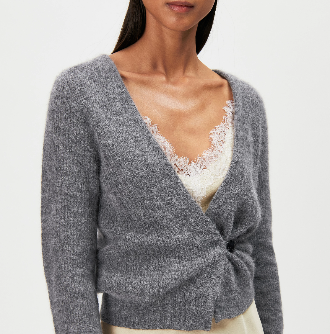 Drykorn LOBAIA Wrap Knit for women in Rainy Day Grey with an asymmetric wrap design, deep V-neck and soft alpaca blend.