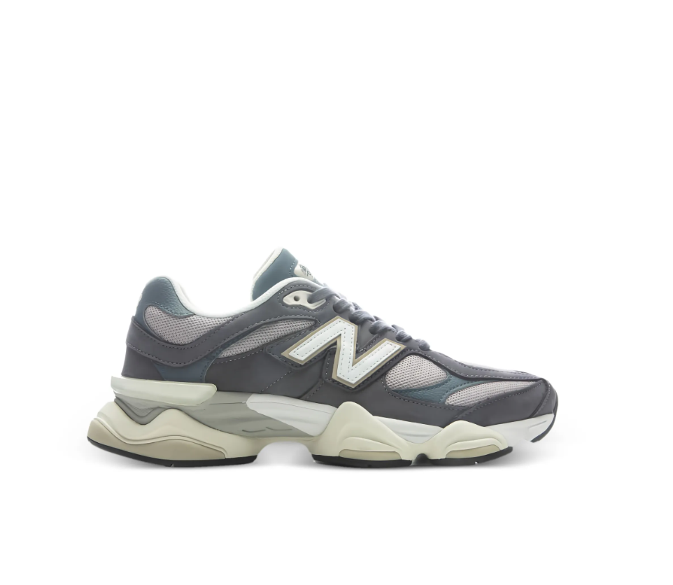 New Balance 9060 sneakers for women in grey with mesh and leather upper, chunky sole, and logo detail.