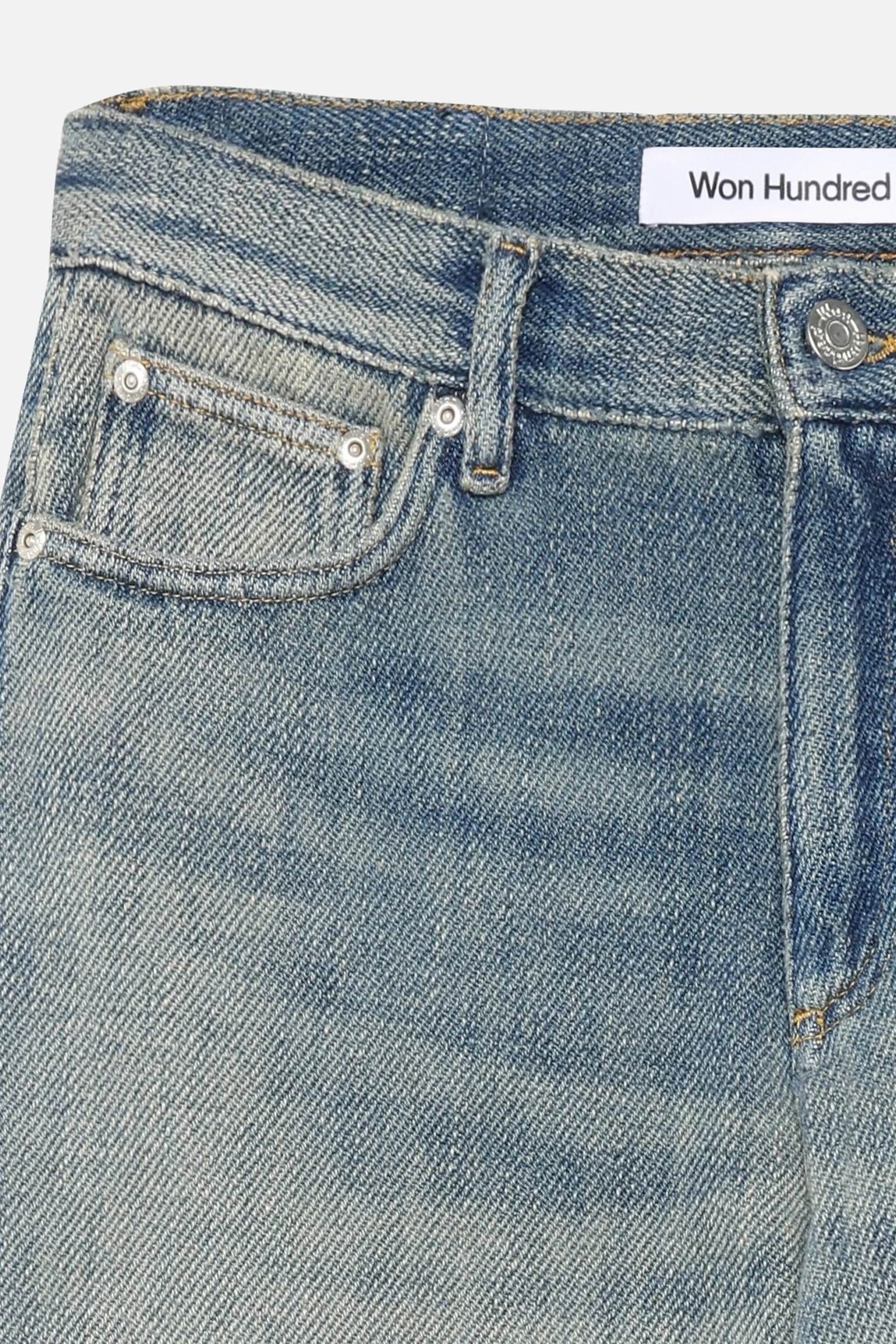 Won Hundred CASE Denim Pants for men in Sticky Blue, crafted from 100% cotton with heavy denim, a fluid drape and vintage-inspired faded details.