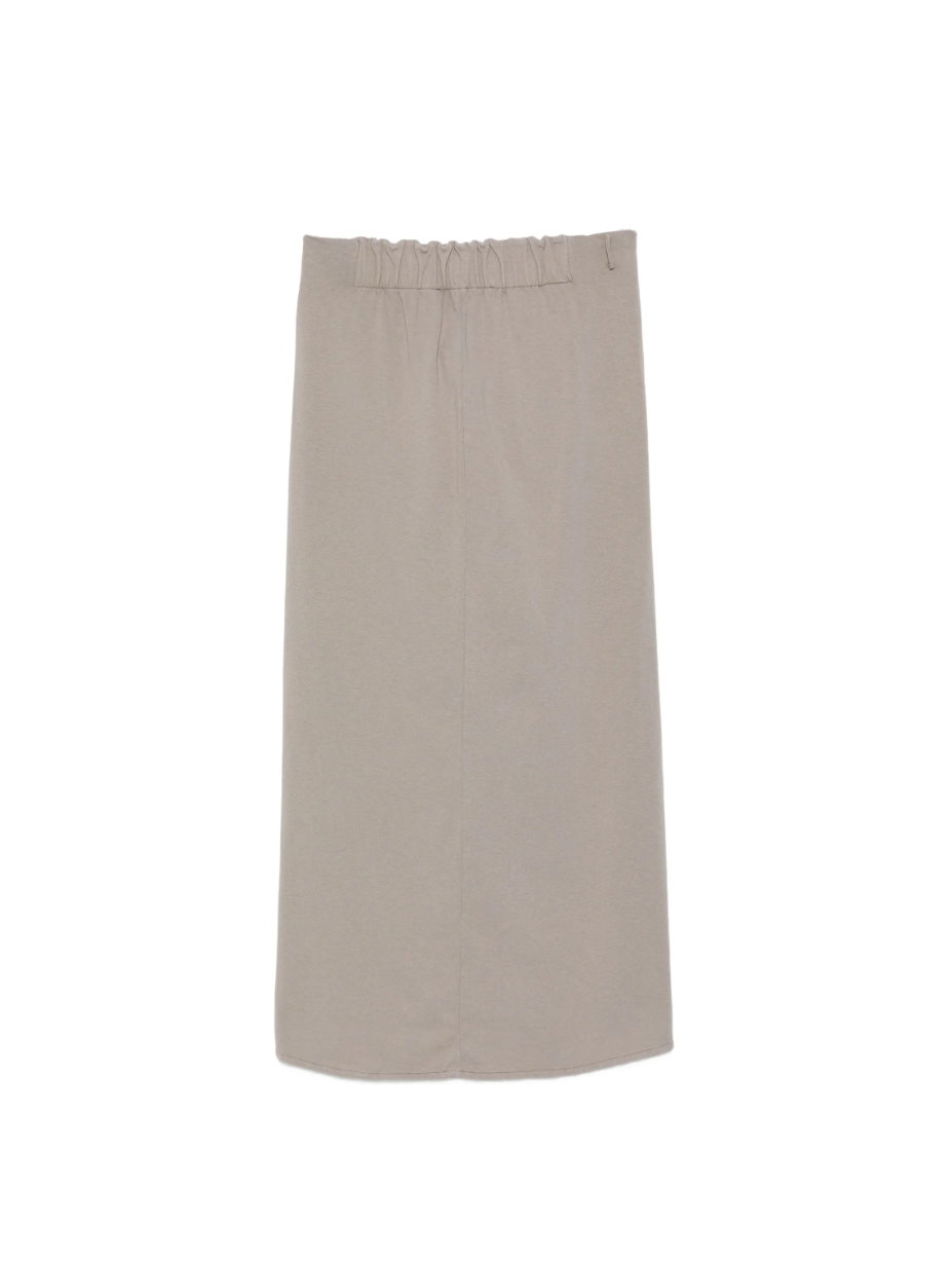Grey pencil maxi skirt by Tela in cotton jersey with asymmetric ruching, front knot detail, slit, and back tie bow.