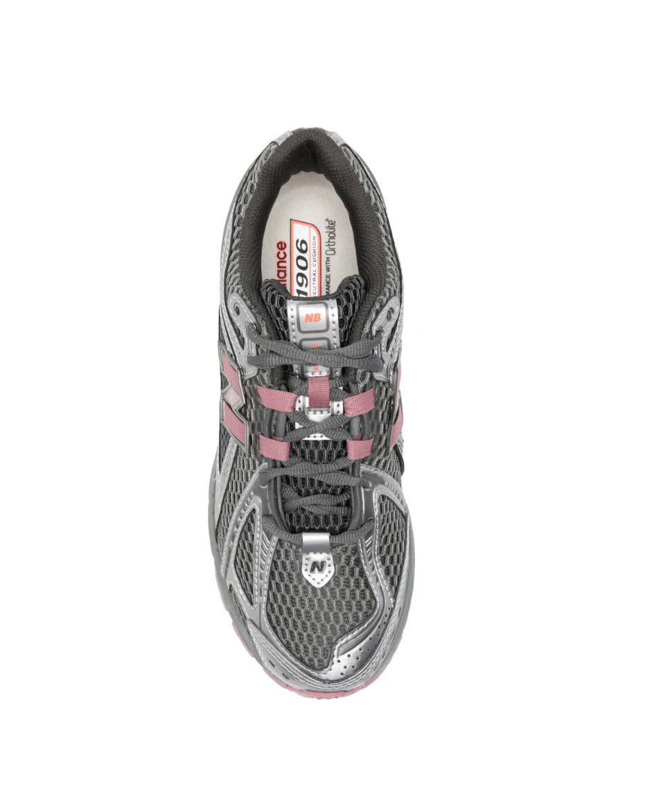 New Balance 1906R sneakers in rosewood with mesh panels, logo patch, and chunky sole.