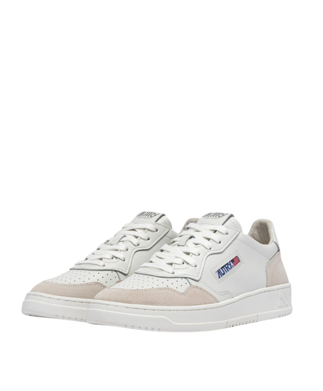 Autry Medalist sneakers in white with suede overlays, perforated toe, and rubber sole.