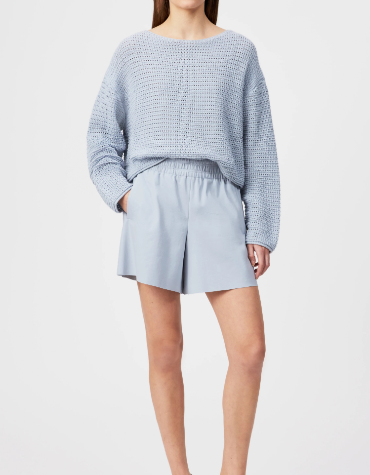 Blue cropped oversized sweater by Drykorn with boat neckline and chunky cotton knit for relaxed contemporary style.