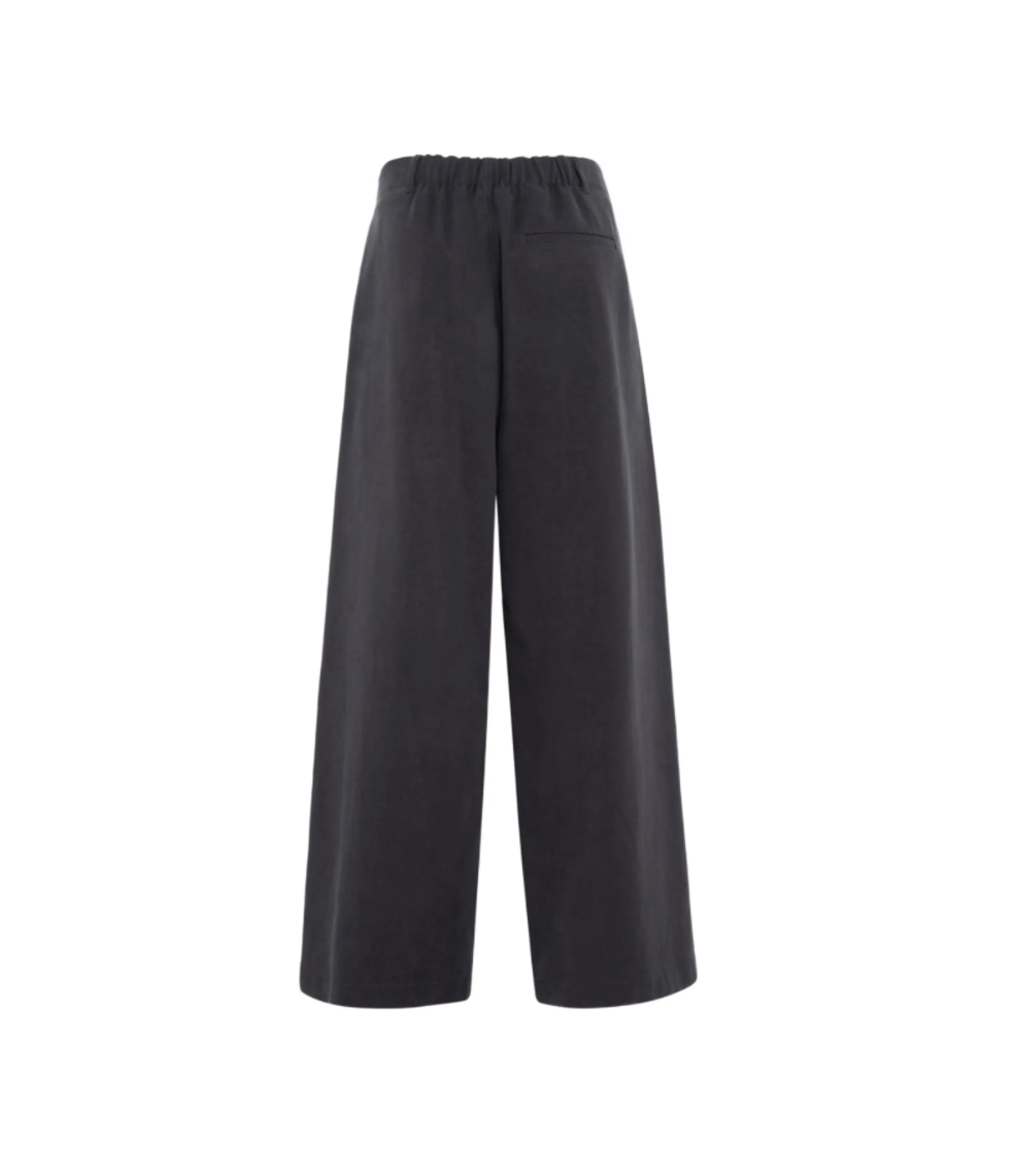 TELA WANDA Wide-Leg Trousers in Dark Grey, featuring a relaxed silhouette, elasticated back waistband, belt loops and practical pockets.